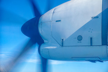 Propeller captured while airplane flying over the sky