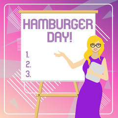 Text sign showing Hamburger Day. Business photo showcasing celebrates the history of this most irresistible of sandwiches White Female in Glasses Standing by Blank Whiteboard on Stand Presentation