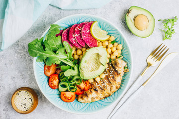 Grilled chicken and fresh vegetable salad. Healthy diet food concept. On a light background, top view