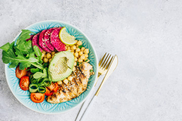 Grilled chicken and fresh vegetable salad. Healthy diet food concept. On a light background, top view