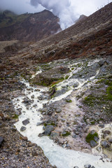 Rocky stream with white water on a mountain. Beautiful landscape of mount Papandayan. Papandayan Mountain is one of the favorite place to hike on Garut.