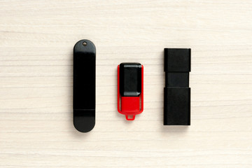 usb flash memory sticks at wooden background. top view. portable storage device.