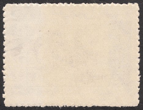 Reverse side of postage stamp made of cotton,shaggy edges