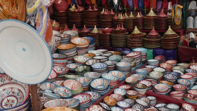 Traditional Moroccan marrakech market with plates and tajin tagine. Handmade ceramic plates. Arabian colorful ramadan design