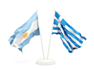 Fototapeta premium Two waving flags of Argentina and greece isolated on white