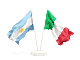 Two waving flags of Argentina and italy isolated on white