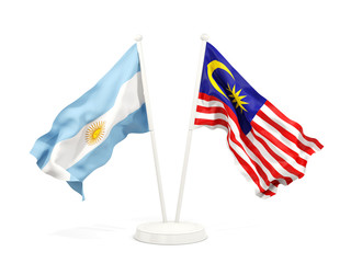 Two waving flags of Argentina and malaysia isolated on white