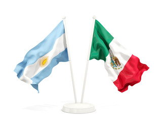 Two waving flags of Argentina and mexico isolated on white