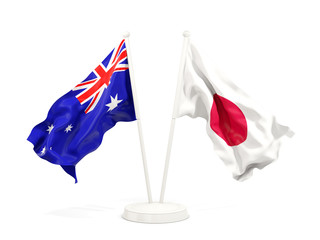 Two waving flags of Australia and japan isolated on white