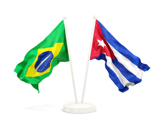 Two waving flags of Brazil and cuba isolated on white