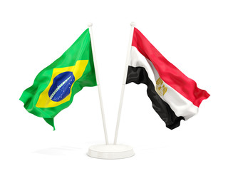Two waving flags of Brazil and egypt isolated on white
