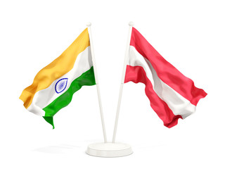 Two waving flags of India and austria isolated on white