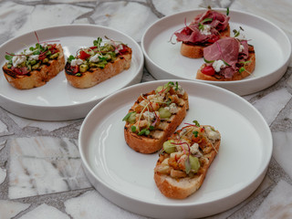 Delicious bruschetta with a variety of fillings.