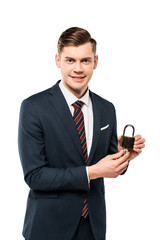 Naklejka premium happy businessman holding padlock with keys isolated on white