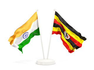 Two waving flags of India and uganda isolated on white