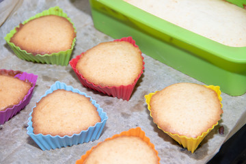 Silicone homemade muffins on parchment. Homemade baking. Sponge cake