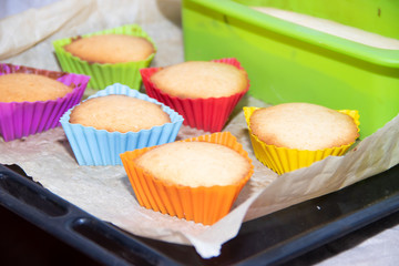 Silicone homemade muffins on parchment. Homemade baking. Sponge cake