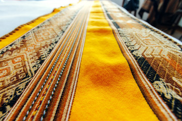Close-up macro of fabric with Peruvian design