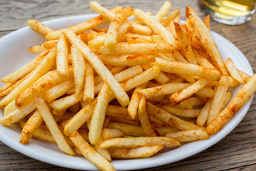 fried potatoes and beer on pub table