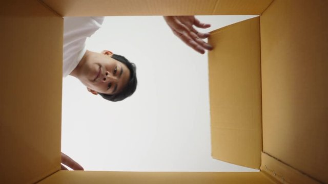 Man unpacking take a product inside box
