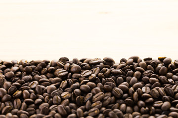 Coffee beans on wood background