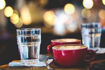Coffee late art in cup on table