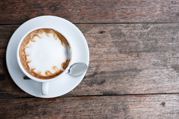 cup of coffee tablet and smart phone on wooden table