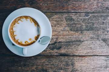 cup of coffee tablet and smart phone on wooden table