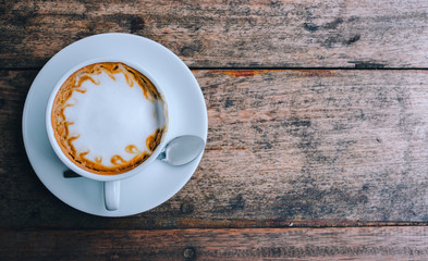 cup of coffee tablet and smart phone on wooden table