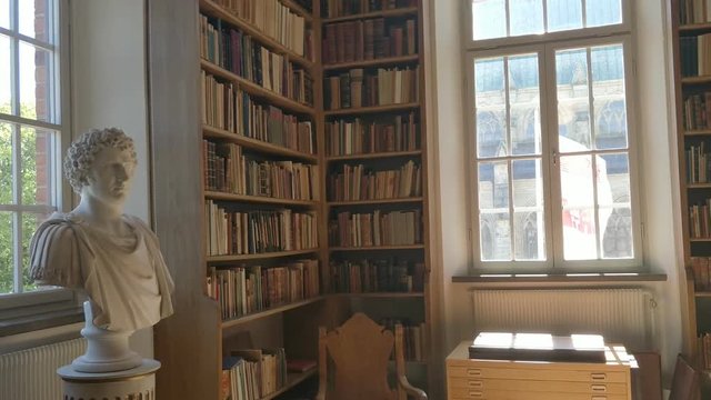 Beautiful Old Library With High Book Shelves Near Window