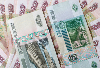 Money. Russian rubles. Notes in denominations of five, ten, and one hundred rubles. Cash.