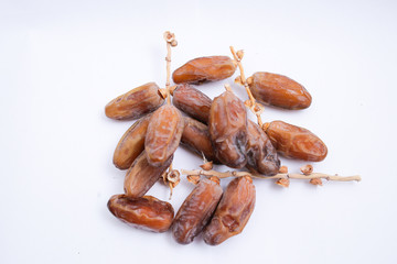 Kurma or dates fruits isolated on white background