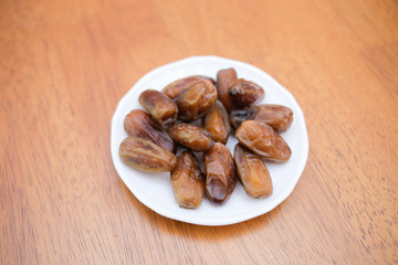 Date palm fruit or kurma on top of the dish