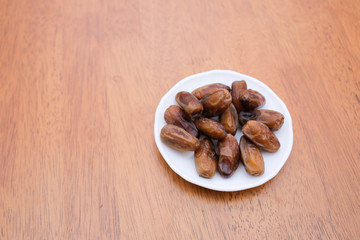 Date palm fruit or kurma on top of the dish