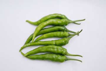 Fresh green chili peppers isolated on white background