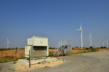 Windmills and electrical substation,  high-voltage substation and wind turbines.