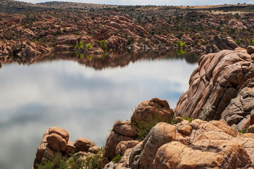 Watson Lake in Prescott, Arizona, USA on a sunny spring day with the clouds reflecting upon the water