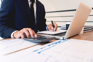 strategy analysis concept, Businessman working  financial Manager Researching Process accounting calculate analyse market graph data stock information review on the table in office.