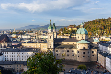 Fototapeta na wymiar View on Salzburg Cathedral and cityscape from Hohensalzburg Fortress. Salzburg. Austria