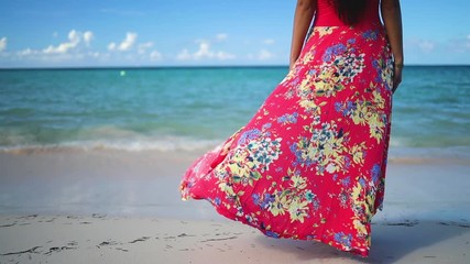 Carefree young woman relaxing on exotic beach. Caribbean tropical vacation