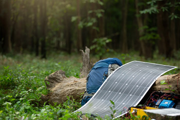 Flexible solar panel in a mountain base camp. Solar Chargers for Camping, Power Box Battery Camping...