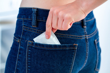 Condom for safe, protected sex. Protection and prevention of venereal diseases and sexually...