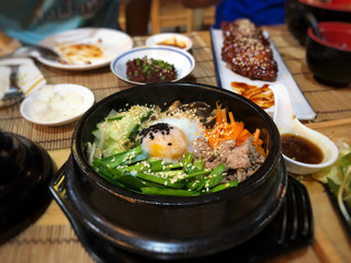 BIBIMBAP, Healthy eating. Delicious Korean Mixed rice with meat and Vegetables topped with egg.