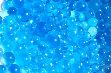 Water blue gel balls. Polymer gel. Silica gel. Balls of blue hydrogel. Crystal liquid ball with...