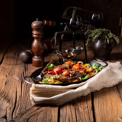 tender beef topped with various vegetables