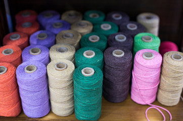 Set of colored threads for sewing on coils.