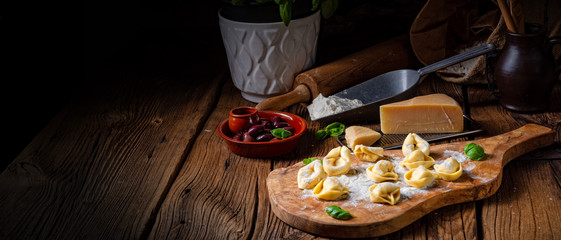 Delicious tortellini di formaggio with cheese and pepper filling - obrazy, fototapety, plakaty