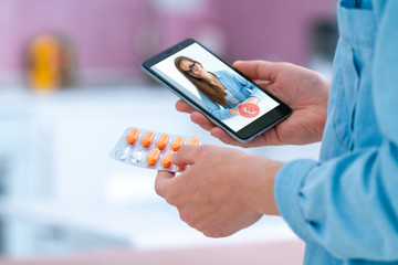 Medicine woman taking pills and vitamins for the treatment of diseases and health. Consultation with a doctor online.