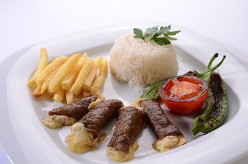 rolled beef steaks filled with cheese with salad and french fries
