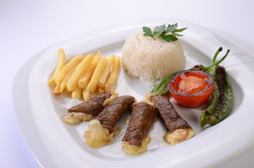rolled beef steaks filled with cheese with salad and french fries